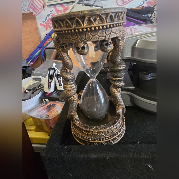 Other - This is a gothic-style hourglass with a snake-shaped Skull Details